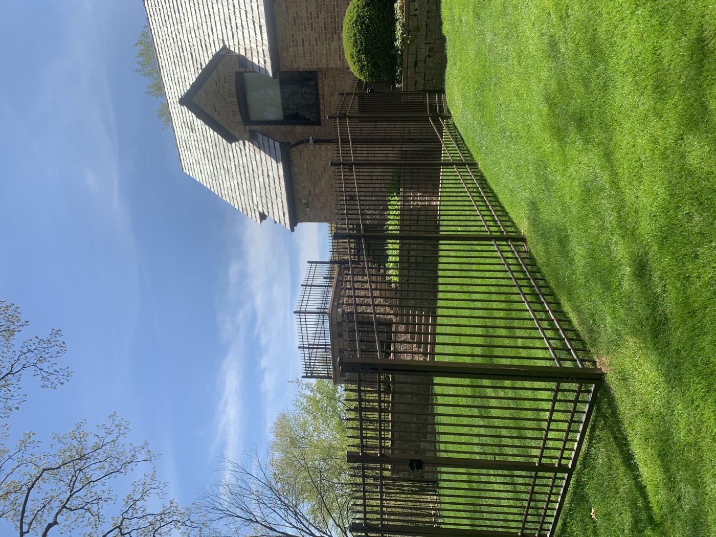 Completed brown ornamental metal fence and gate