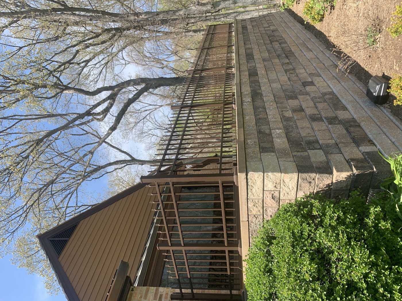 Completed ornamental metal railing installed on a raised property
