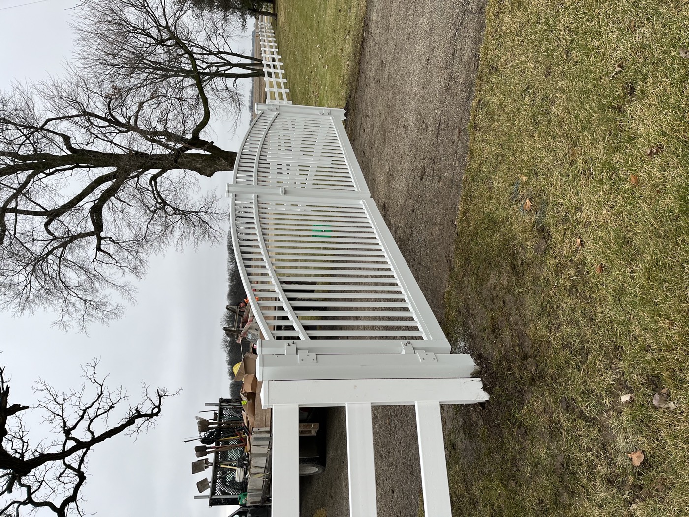 Completed white vinyl double driveway gate